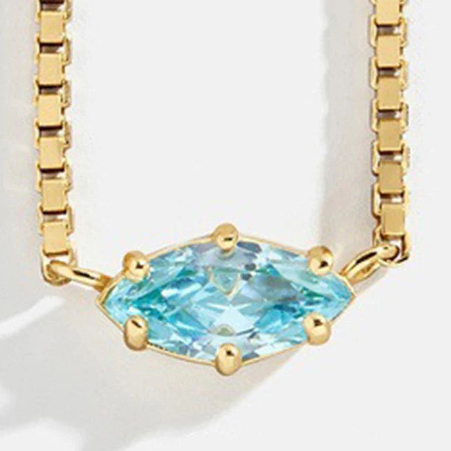 Ketting met oogvormige hanger met geboortesteen maart
