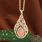 Ketting met traditionele hanger voor Arabische vrouw oranje