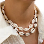 Halsketting met wit kauri-schelpje en wit
