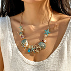 Goudkleurige en blauwachtige schelpketting