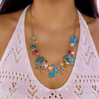 Goudkleurige en blauwachtige schelpketting