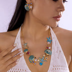 Goudkleurige en blauwachtige schelpketting