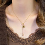 Lariatketting met zonster-hangers en tijgeroogstenen