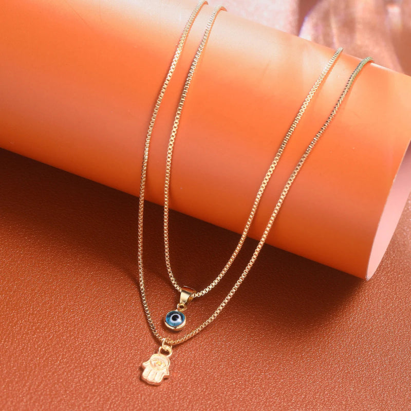 Collier Double avec Pendentif Oeil Bleu Turc et Main de Fatma or