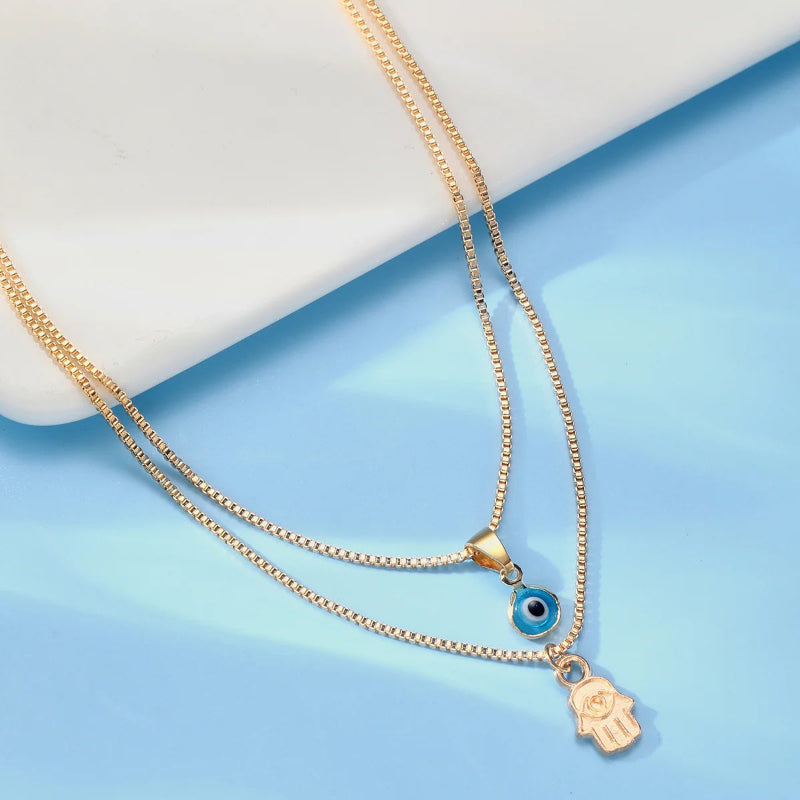 Collier Double avec Pendentif Oeil Bleu Turc et Main de Fatma or