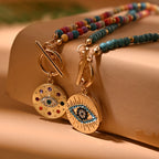 Ketting met gekleurde kralen en beschermende hanger blauw oog blauw oog