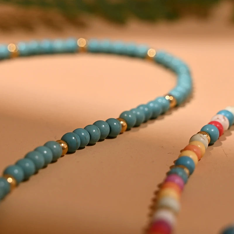 Ketting met gekleurde kralen en beschermende hanger blauw oog