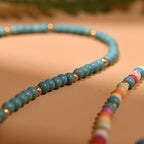 Ketting met gekleurde kralen en beschermende hanger blauw oog