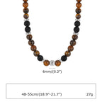 Ketting van lavastenen en tijgeroog met lotusbloemhanger