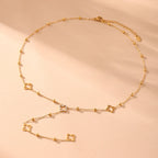 Collier Long avec Pendentifs Trèfle à 4 Feuilles et Zircon or