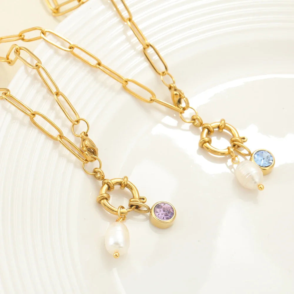 Schakelketting met parelhanger en geboortesteen februari