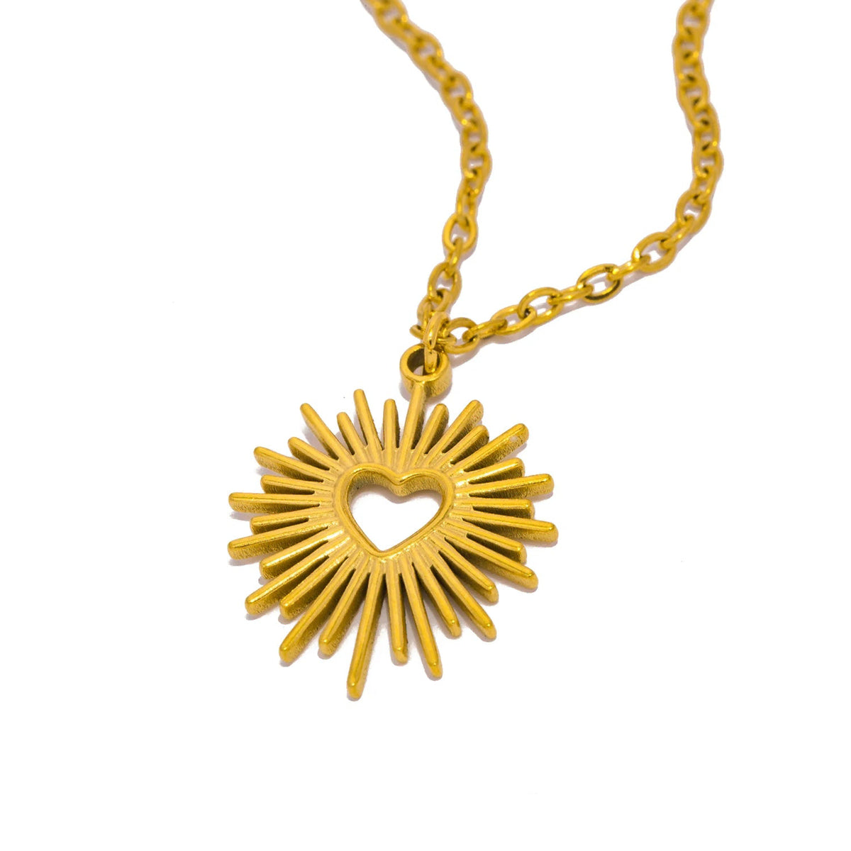 Collier motif soleil éclatant et cœur central or