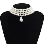 Meerrangige ketting met gouden druppelvormige parelhanger
