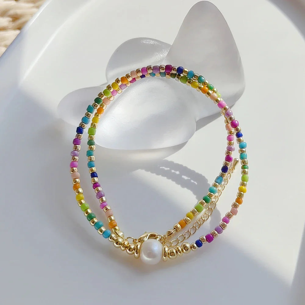 Chokerketting met regenbooghanger en kralen