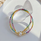 Chokerketting met regenbooghanger en kralen