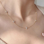 Choker met fonkelende klaverbloem-hangers goud
