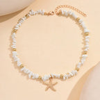 Korte ketting met schelp en zeester, wit, grote kralen