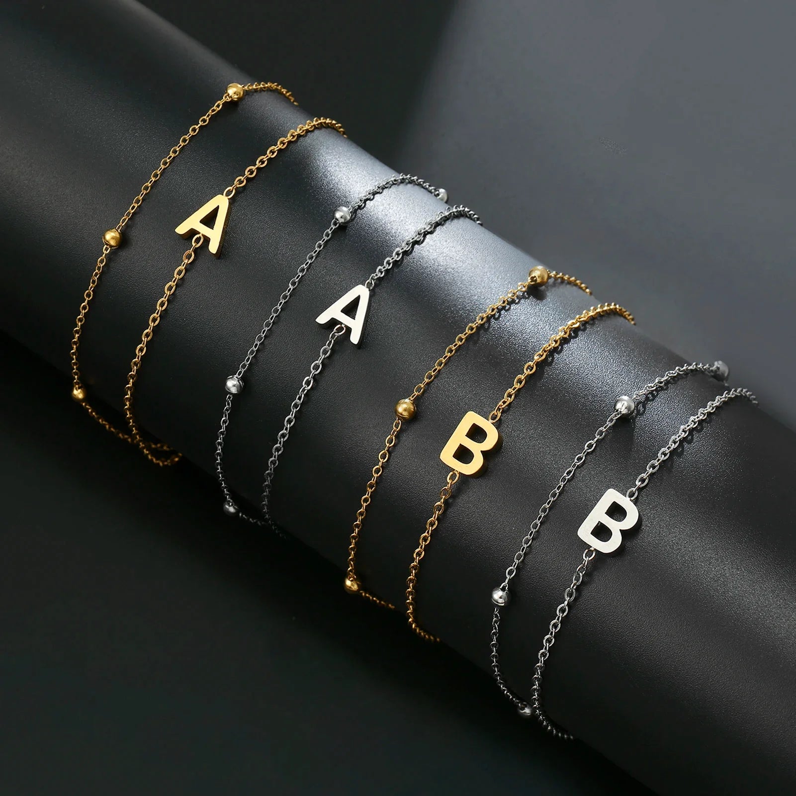 Dubbele initiaal armband goud en zilver