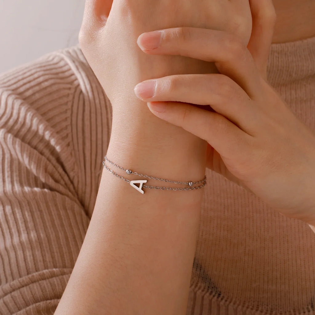 Dubbele initiaal armband goud en zilver 