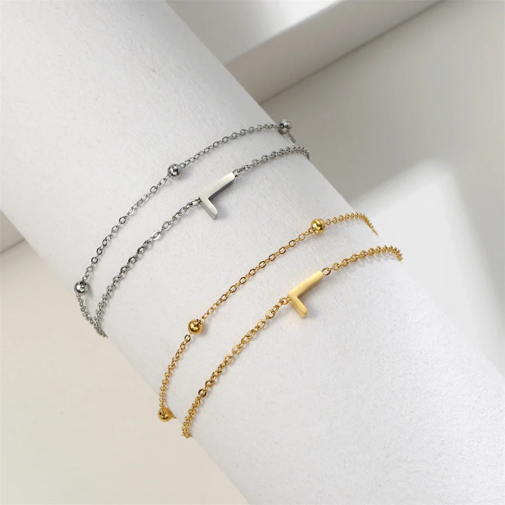 Dubbele initiaal armband goud en zilver l