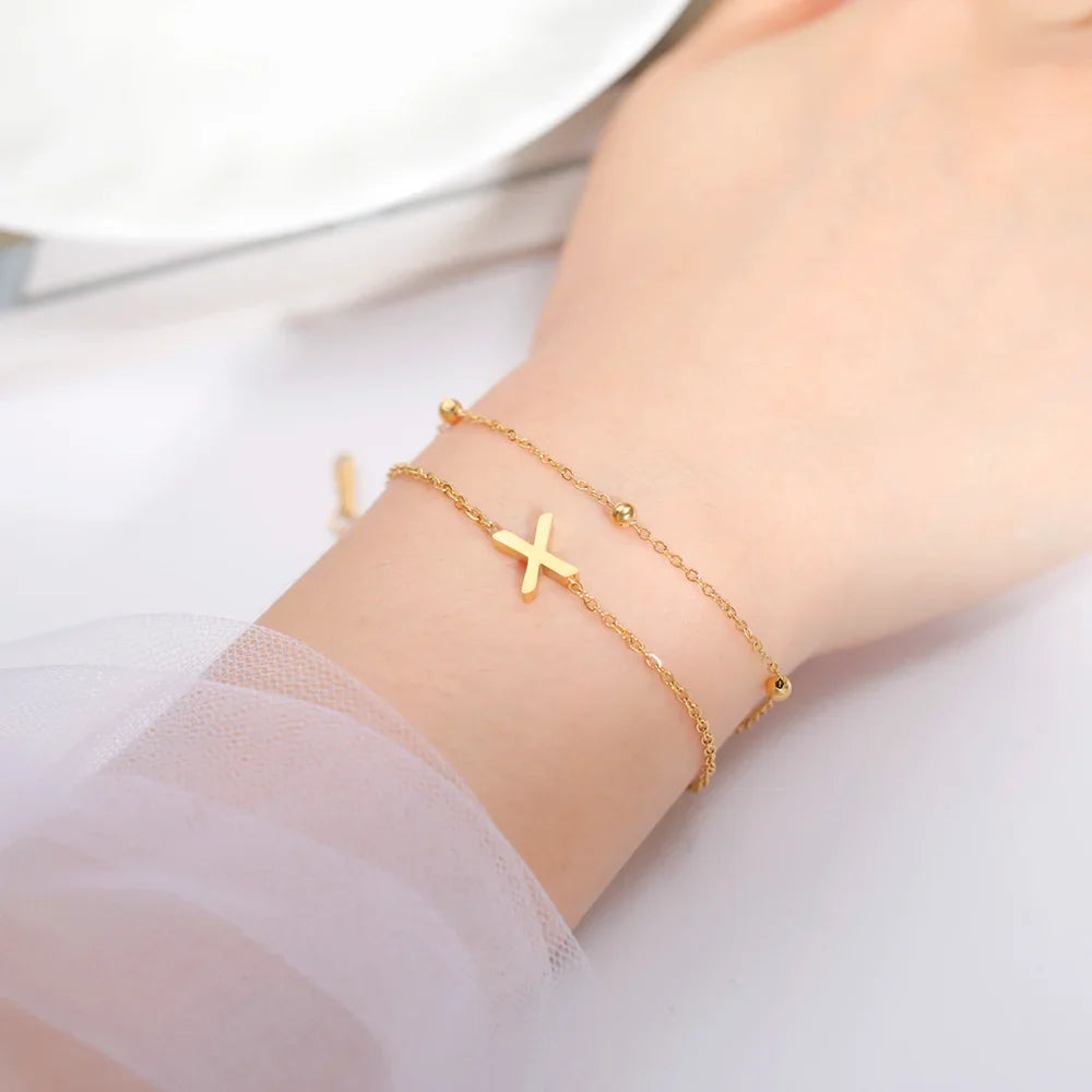 Dubbele initiaal armband goud 