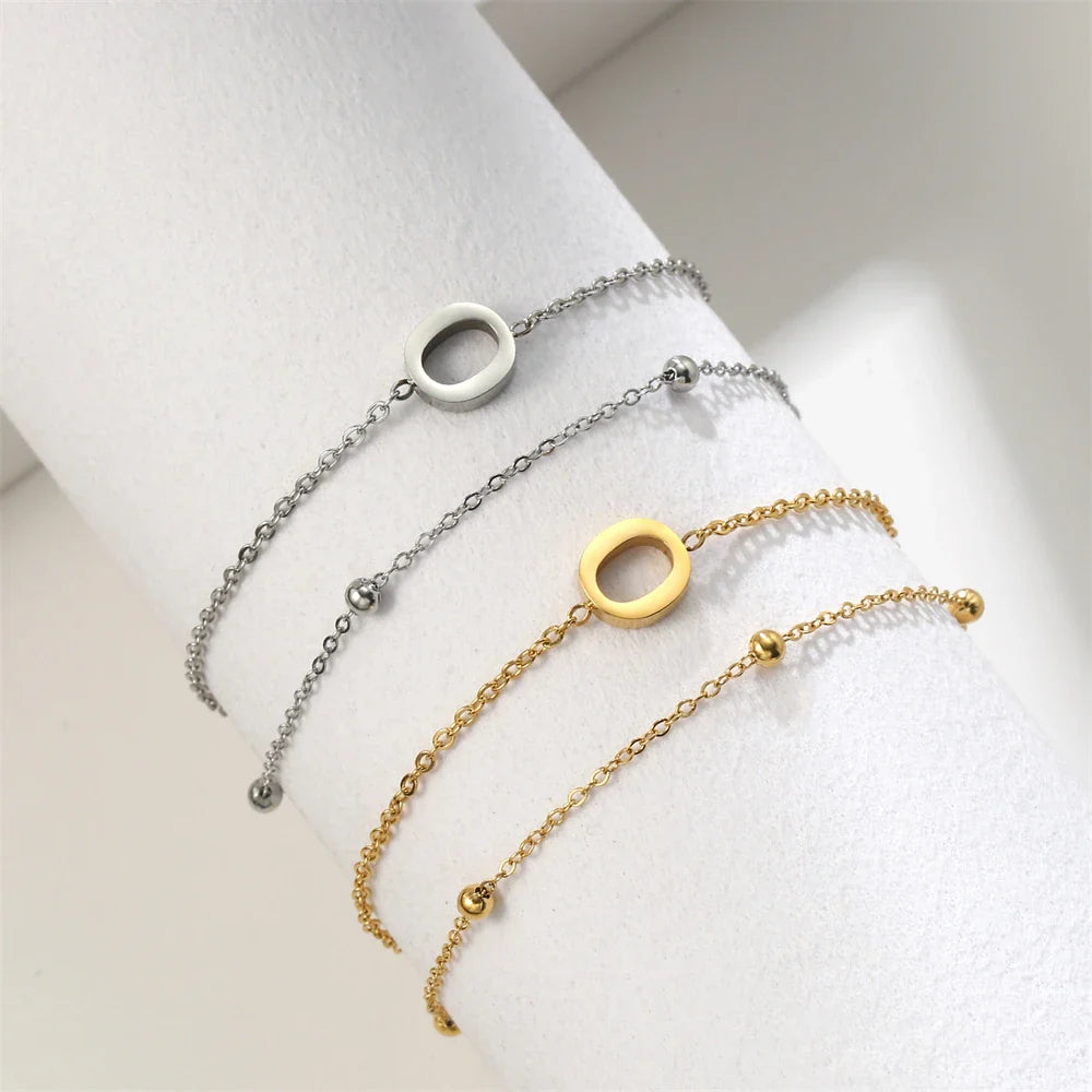Dubbele initiaal armband goud en zilver  o
