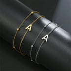 Dubbele initiaal armband goud en zilver  a