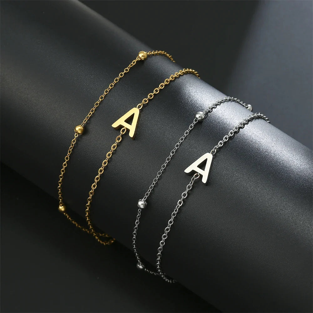 Dubbele initiaal armband goud en zilver  a