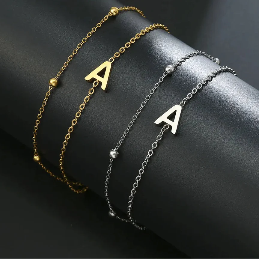 Dubbele initiaal armband goud en zilver a