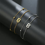 Dubbele initiaal armband goud en zilver  b