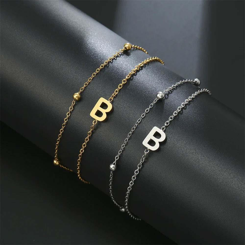 Dubbele initiaal armband goud en zilver  b