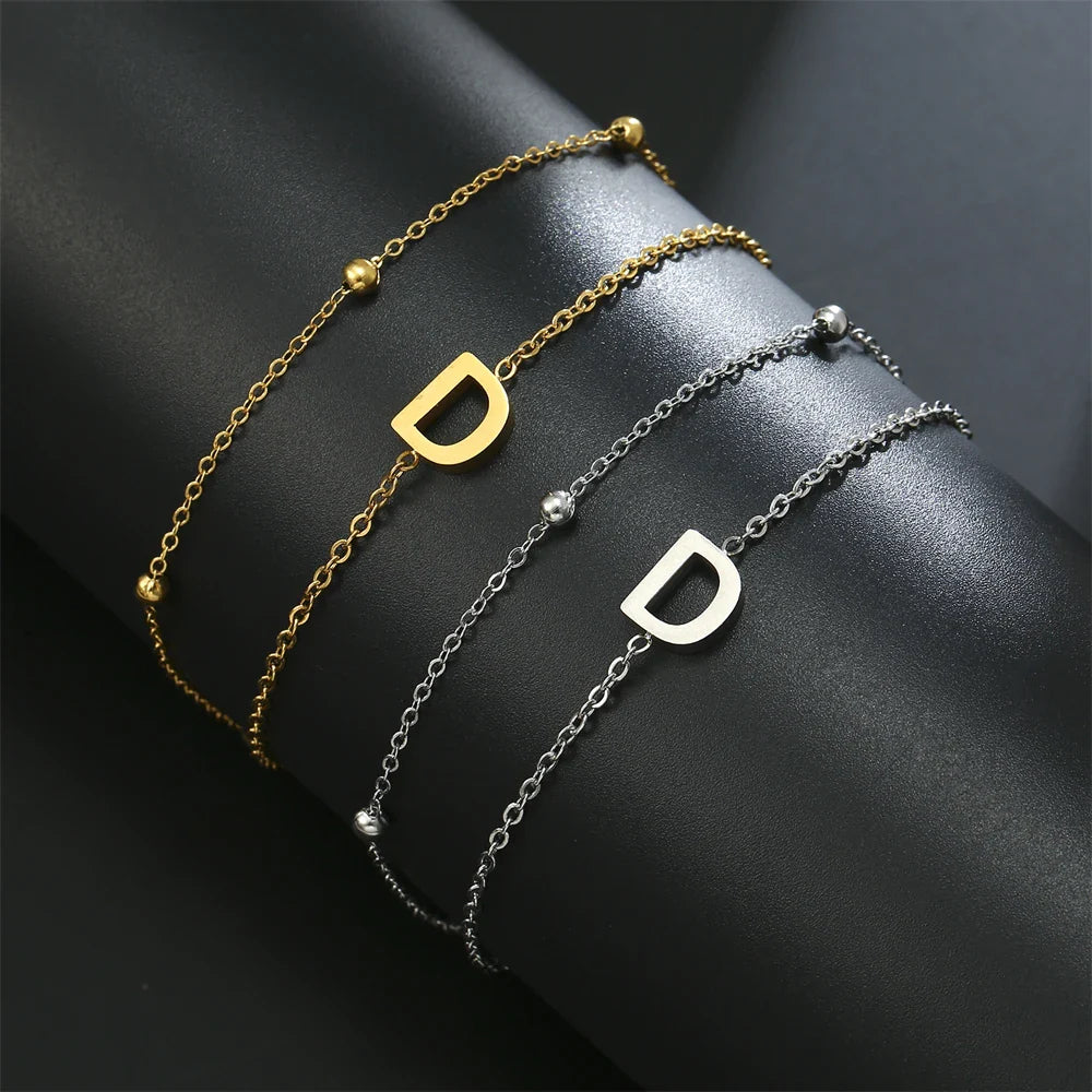 Dubbele initiaal armband goud en zilver  d