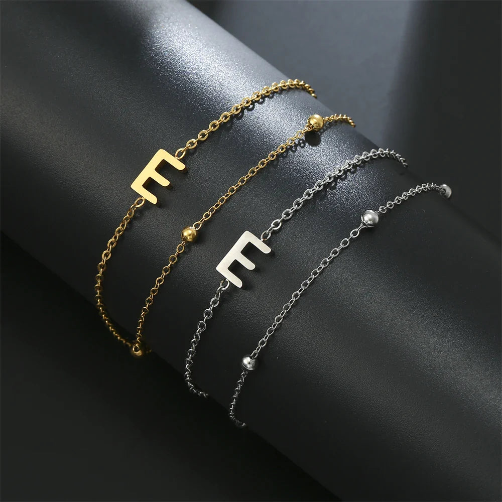 Dubbele initiaal armband goud en zilver  e