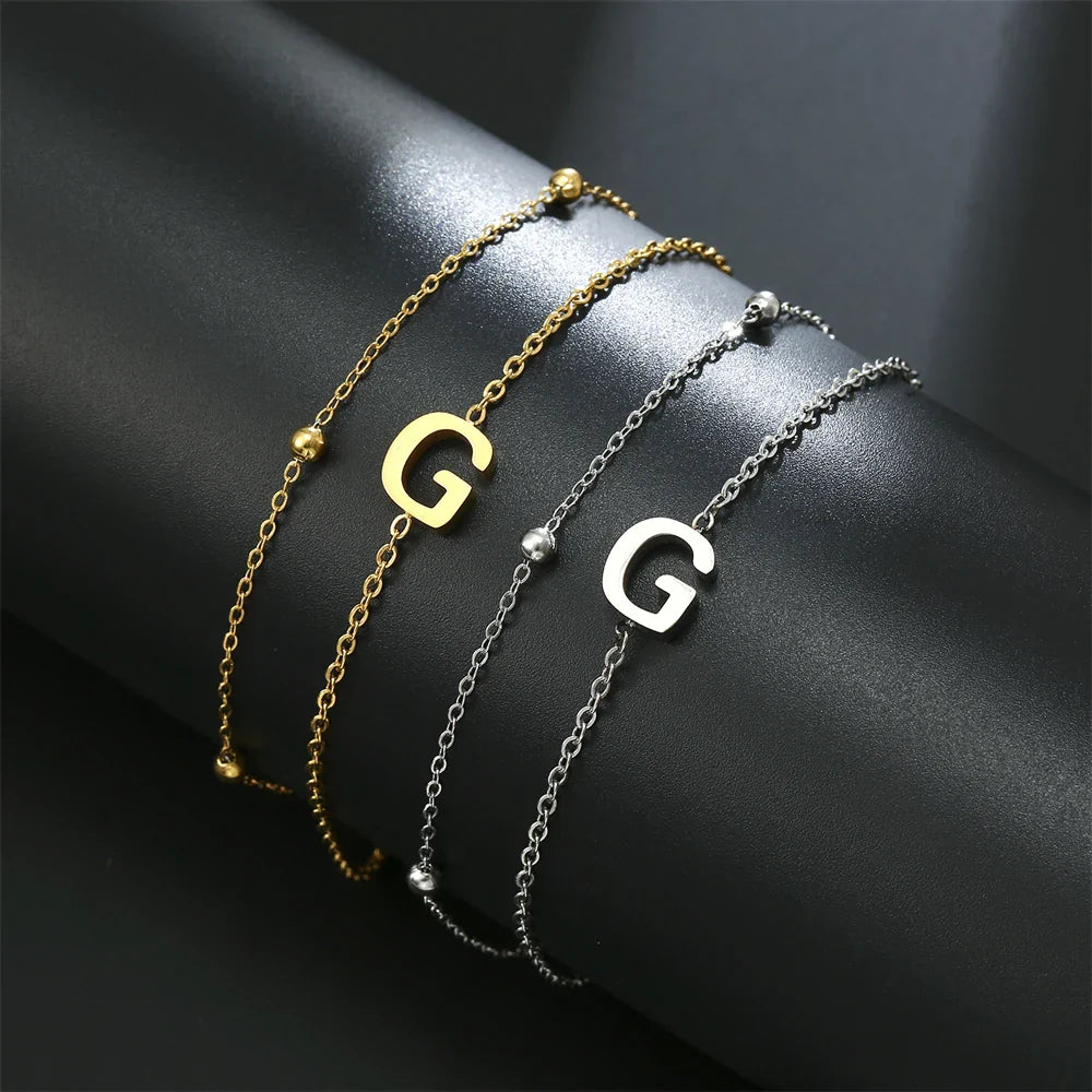 Dubbele initiaal armband goud en zilver  g