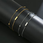 Dubbele initiaal armband goud en zilver  i