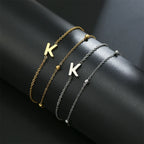 Dubbele initiaal armband goud en zilver k