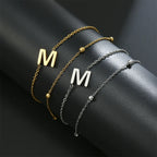 Dubbele initiaal armband goud en zilver  m