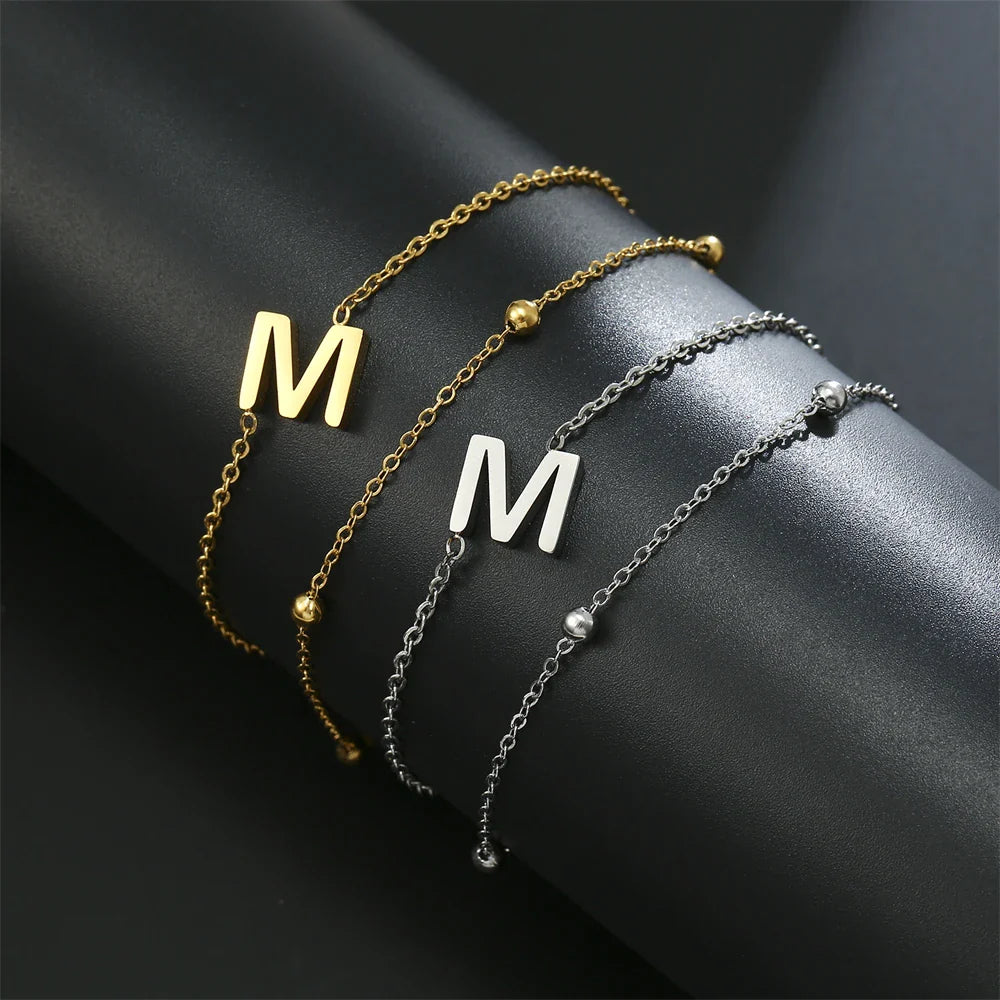 Dubbele initiaal armband goud en zilver  m