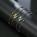 Dubbele initiaal armband goud en zilver  n