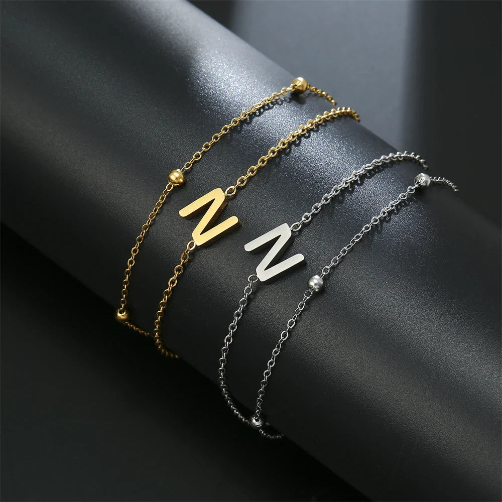 Dubbele initiaal armband goud en zilver  n