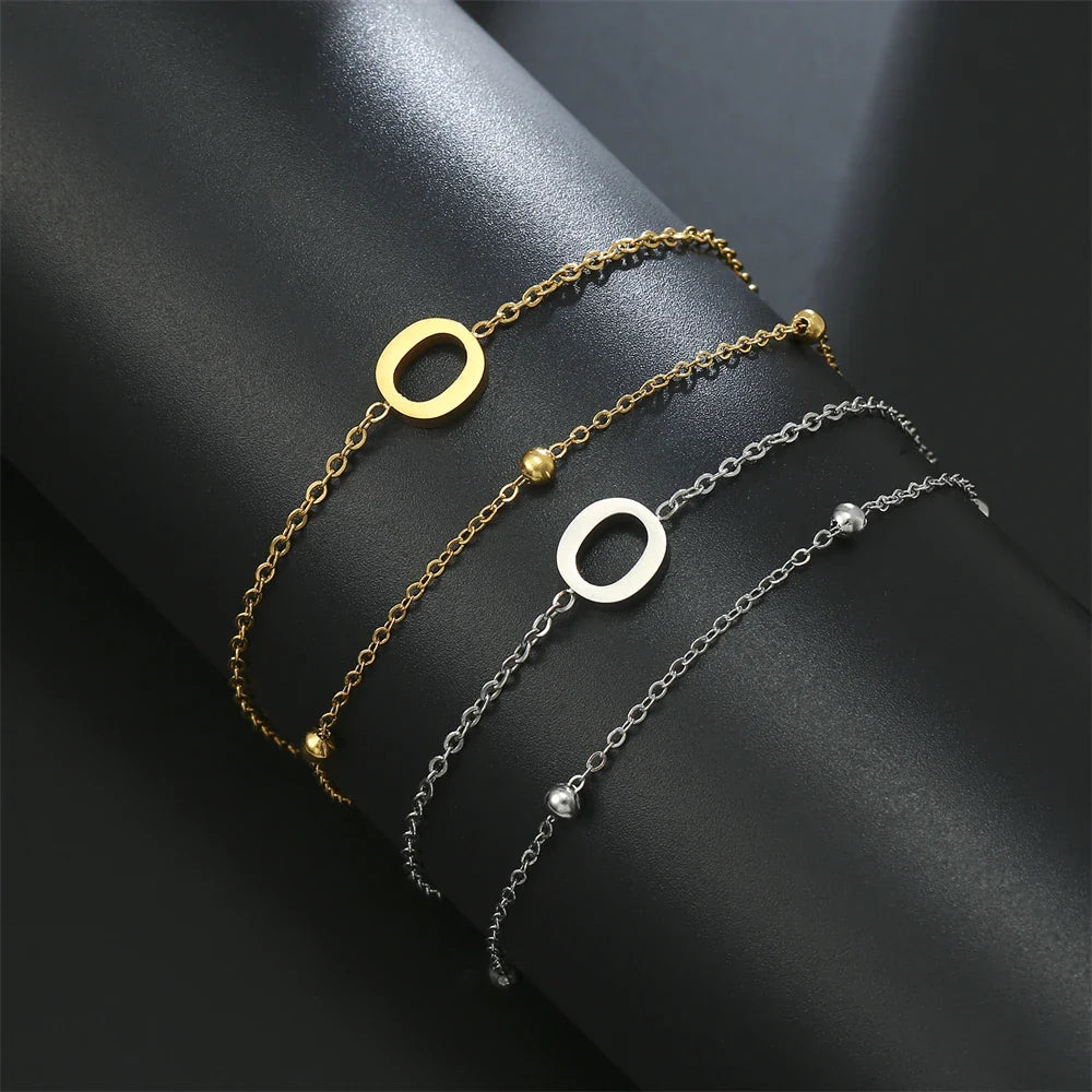 Dubbele initiaal armband goud en zilver  o