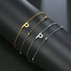 Dubbele initiaal armband goud en zilver  p