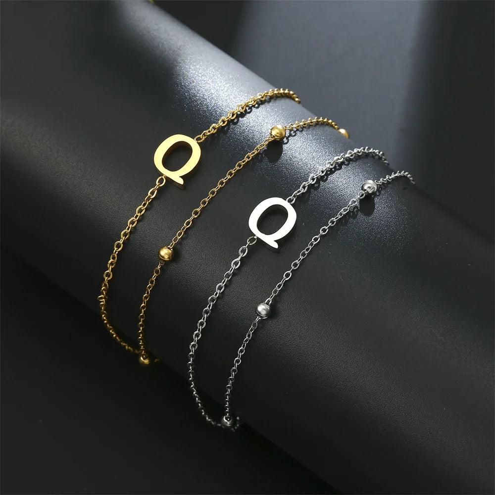 Dubbele initiaal armband goud en zilver  q