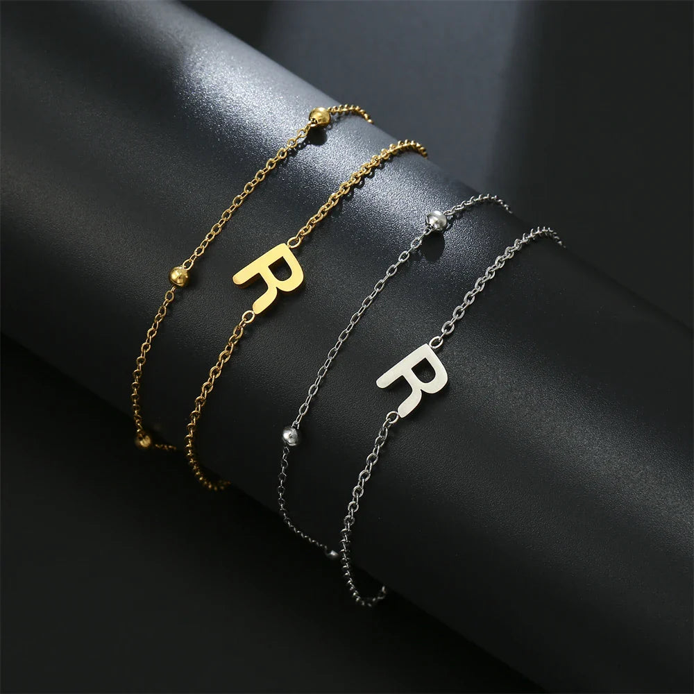 Dubbele initiaal armband goud en zilver  r