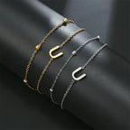 Dubbele initiaal armband goud en zilver  u