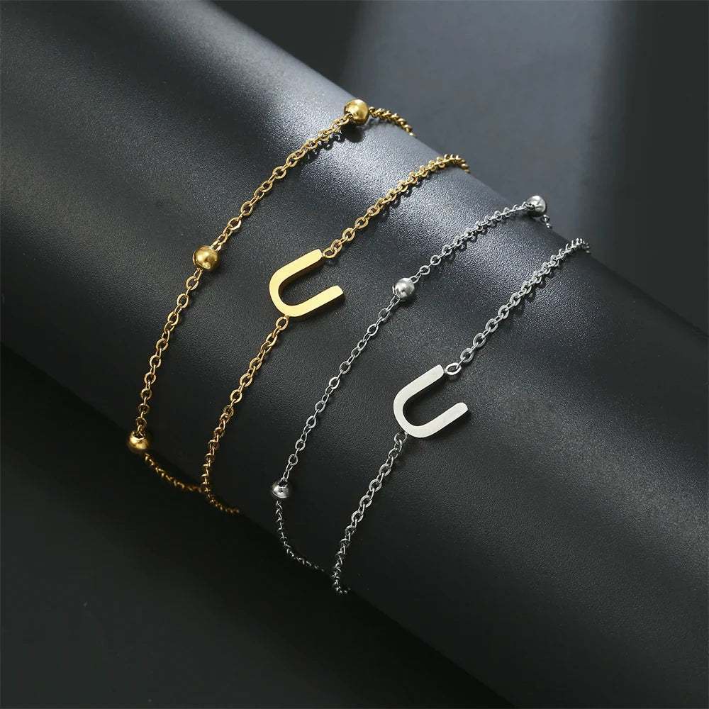 Dubbele initiaal armband goud en zilver  u
