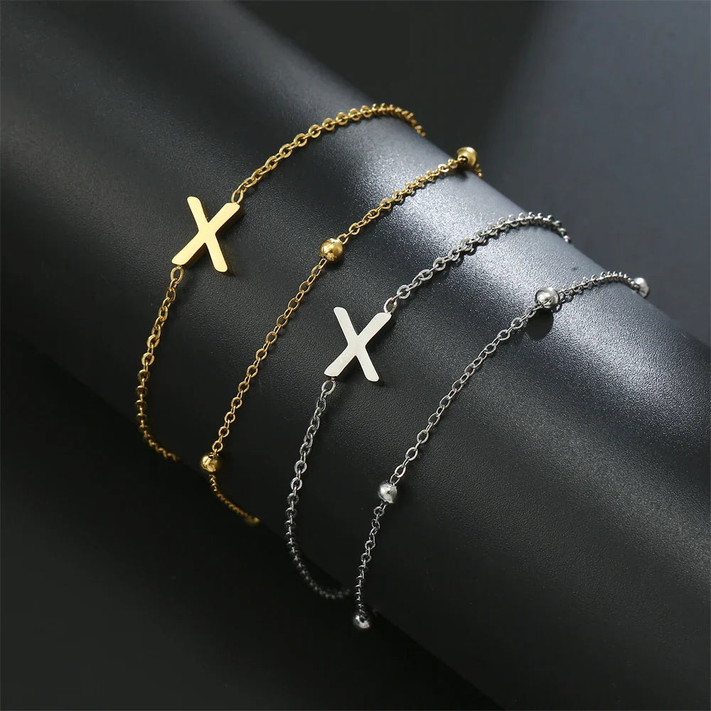 Dubbele initiaal armband goud en zilver  x