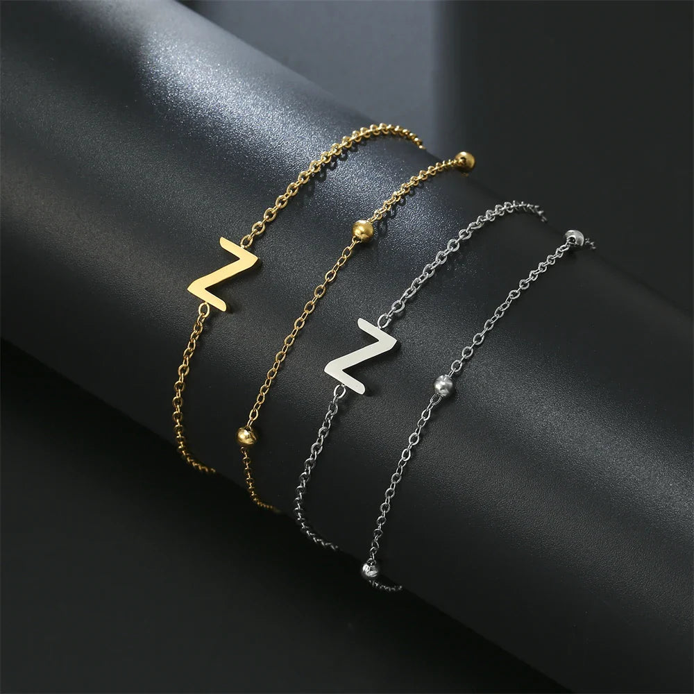 Dubbele initiaal armband goud en zilver  z