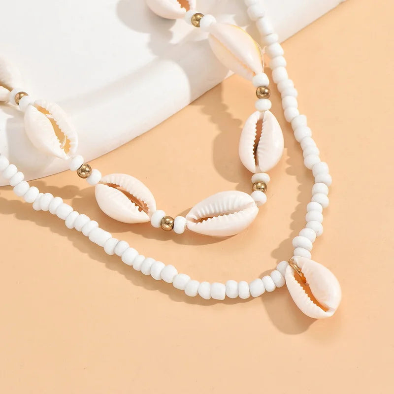 Dubbele ketting met kaurischelp wit