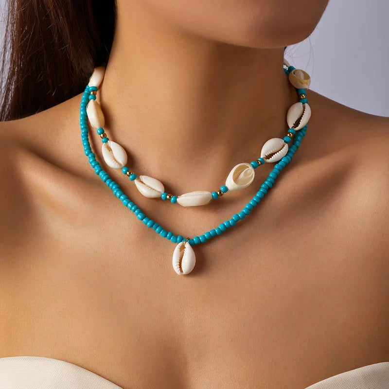 Dubbele ketting met kaurischelp turquoise